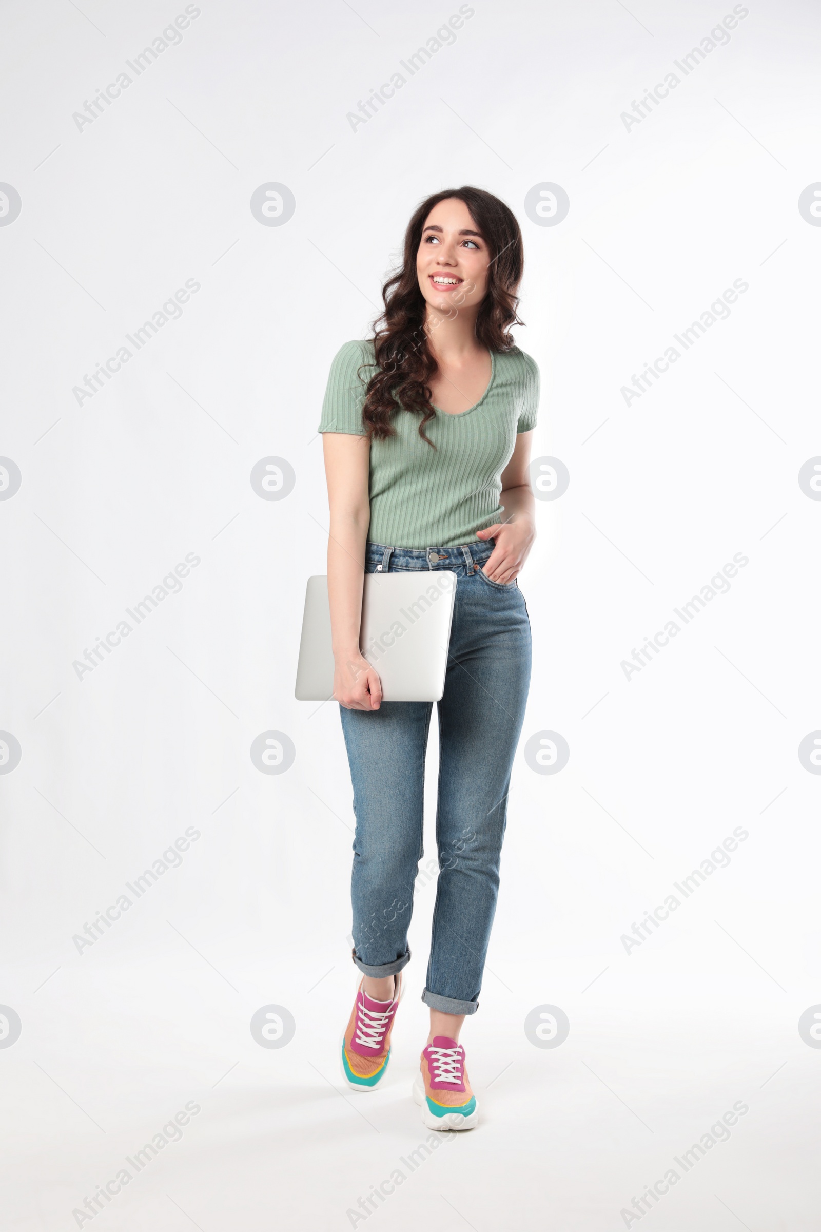 Photo of Young woman with laptop on white background