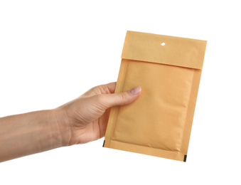 Woman holding kraft paper envelope on white background, closeup