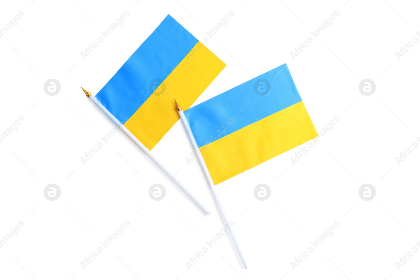 Photo of National flags of Ukraine isolated on white, top view