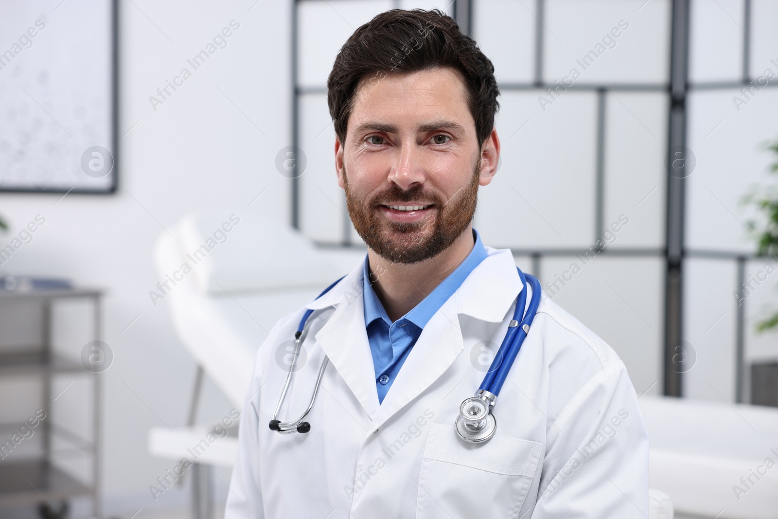 Photo of Portrait of medical consultant with stethoscope in clinic