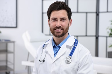 Portrait of medical consultant with stethoscope in clinic