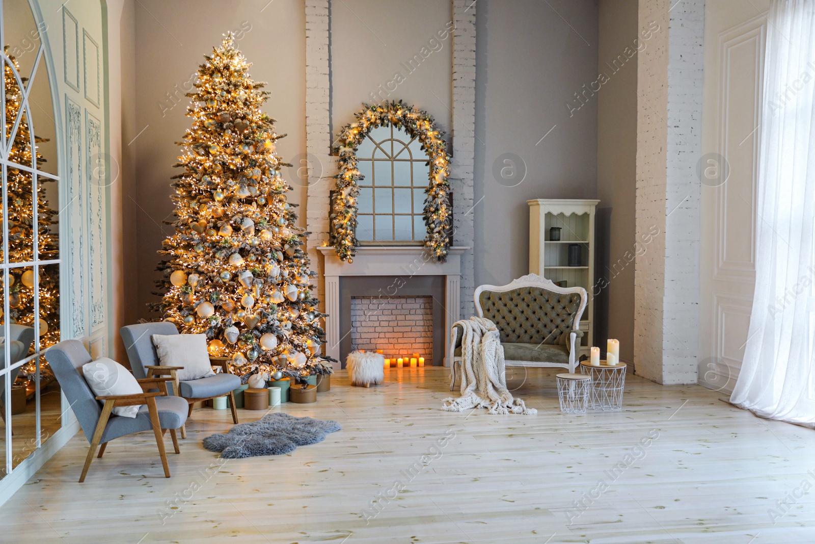 Photo of Festive room interior with stylish furniture and beautiful Christmas tree