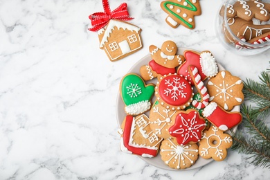 Plate with tasty homemade Christmas cookies on table, top view