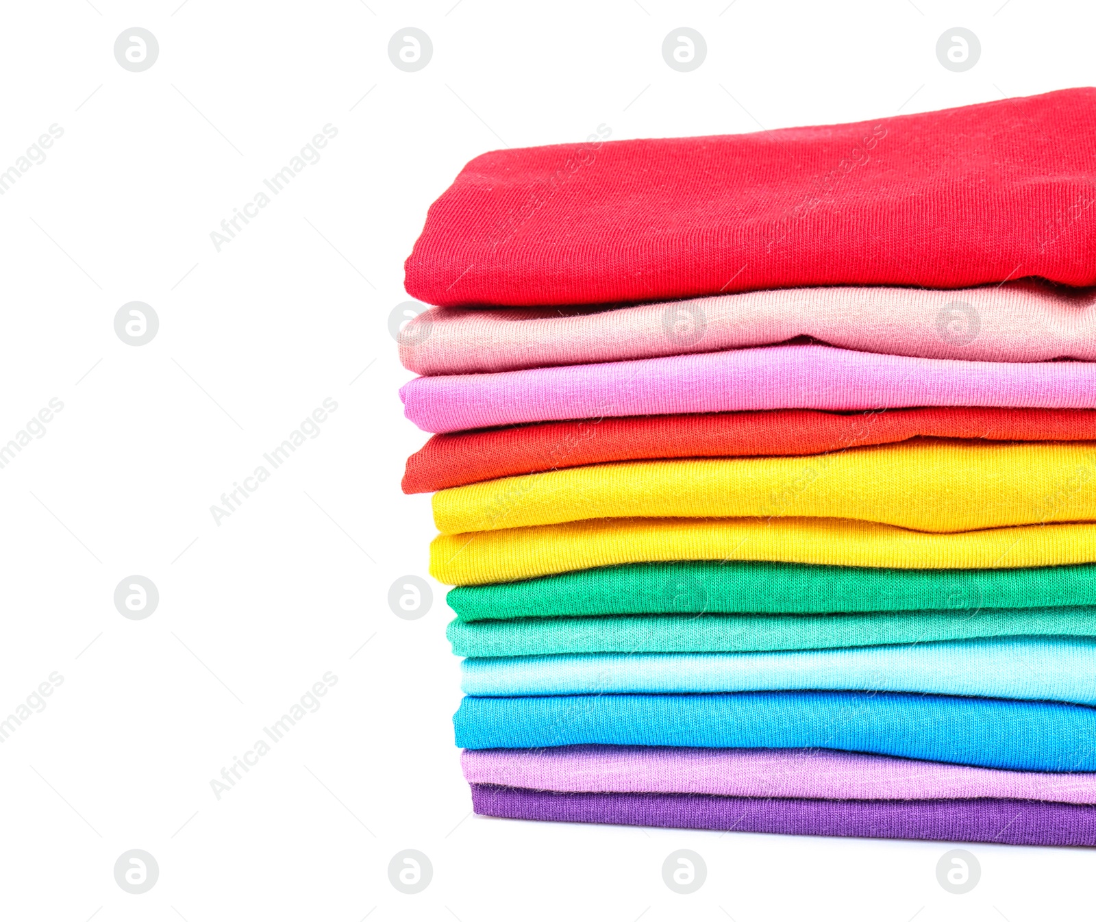 Photo of Stack of colorful t-shirts on white background