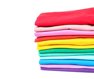 Photo of Stack of colorful t-shirts on white background