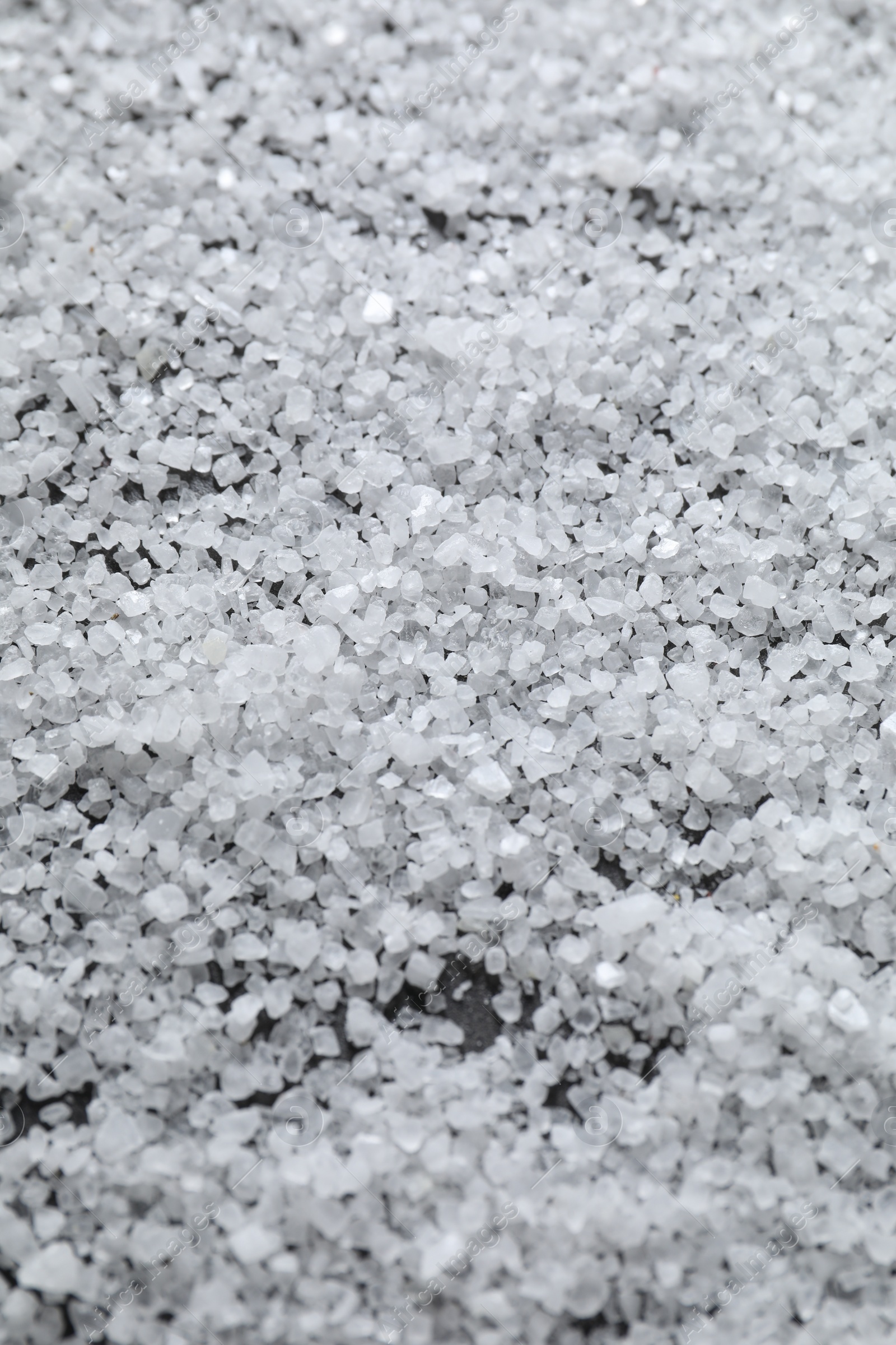 Photo of White natural salt as background, closeup view