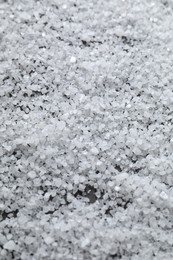 Photo of White natural salt as background, closeup view