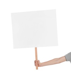 Photo of Woman holding blank sign on white background, closeup