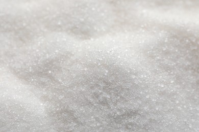 Photo of Sweet granulated sugar as background, closeup view