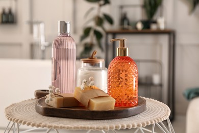 Photo of Liquid soap and other toiletries on table indoors