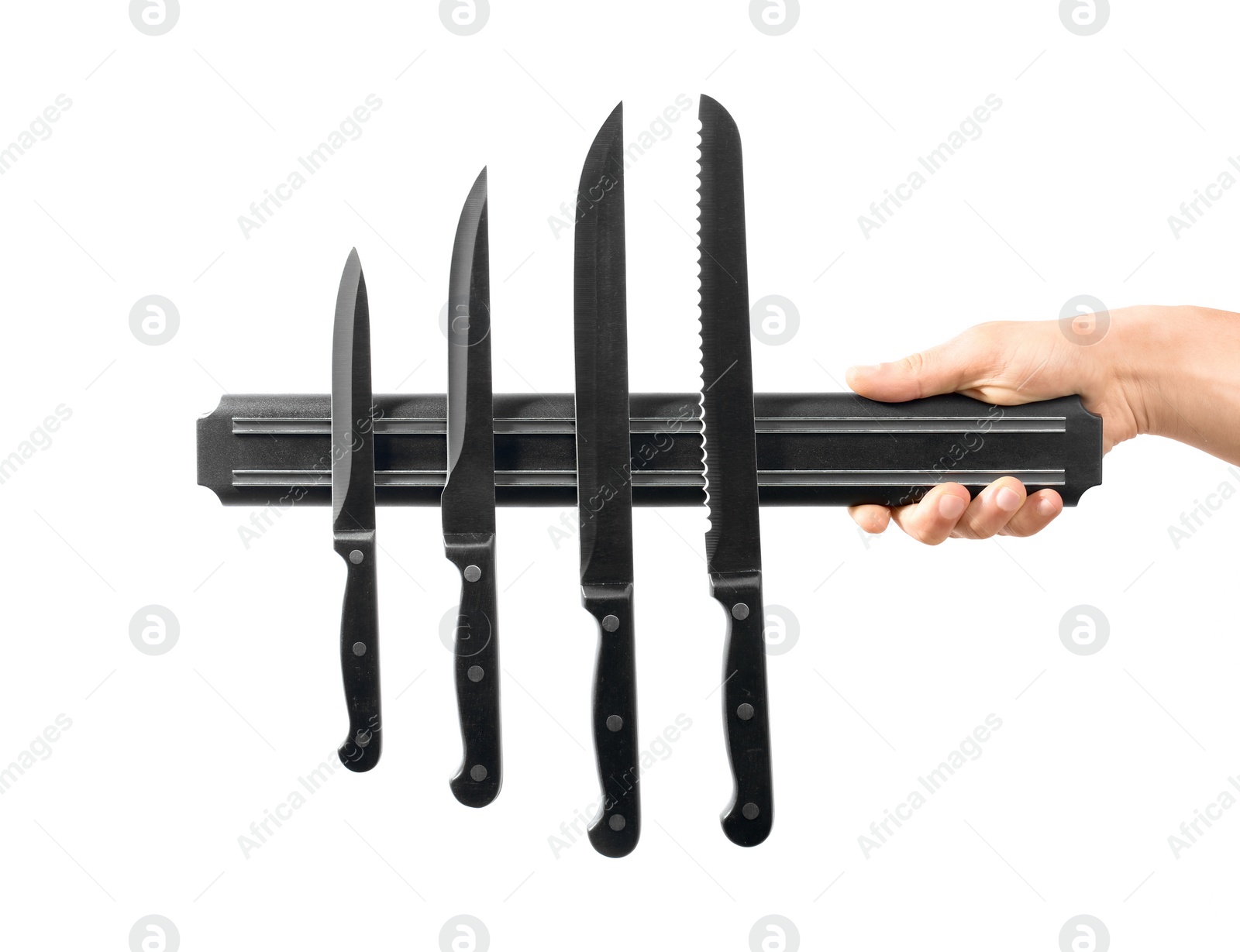 Photo of Man with magnetic holder and different knives isolated on white, closeup