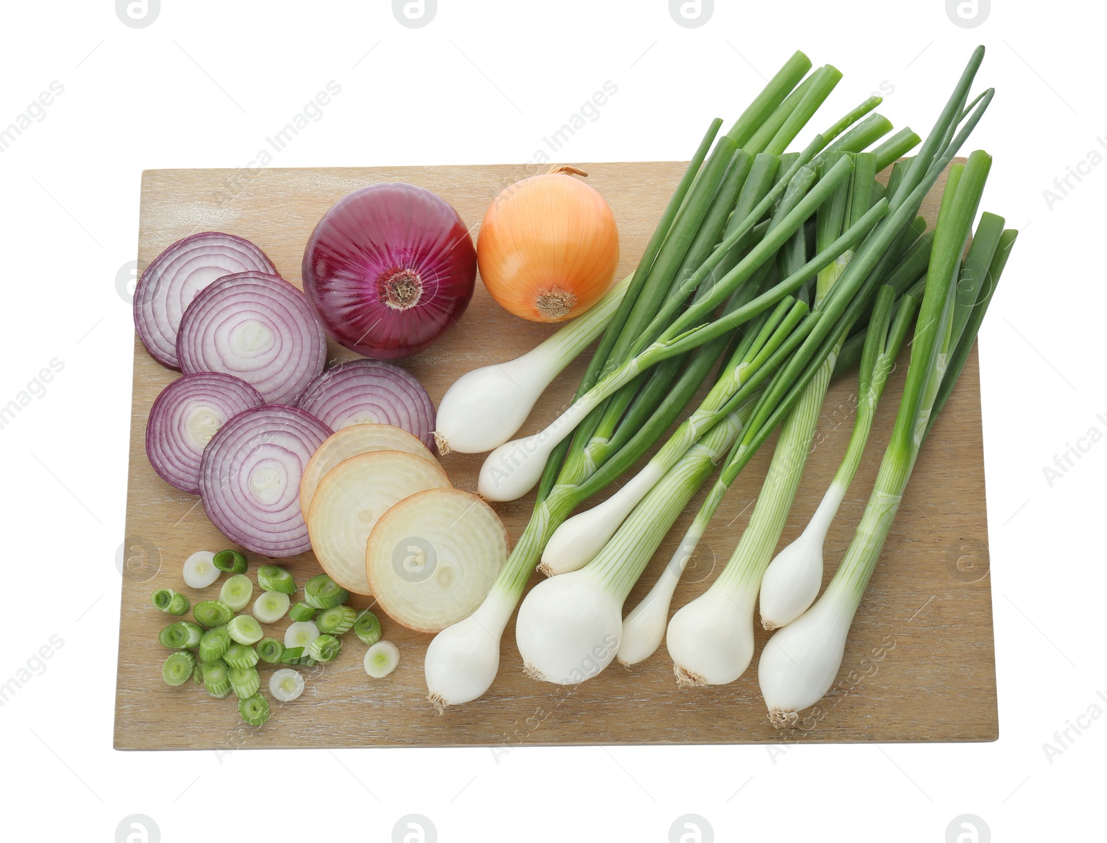 Photo of Wooden board with different kinds of onions isolated on white, top view