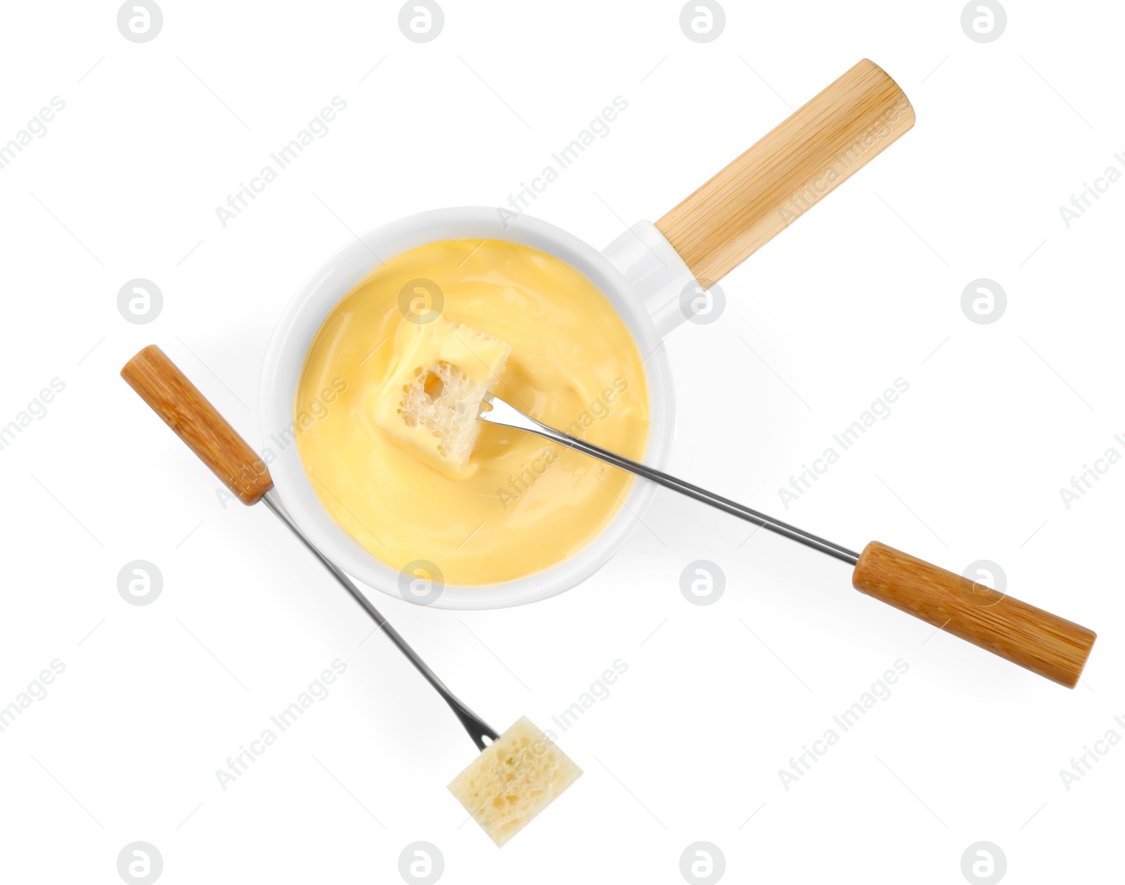 Photo of Pot of tasty cheese fondue and forks isolated on white, top view