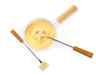 Photo of Pot of tasty cheese fondue and forks isolated on white, top view