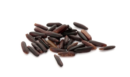 Photo of Uncooked black rice on white background. Healthy diet