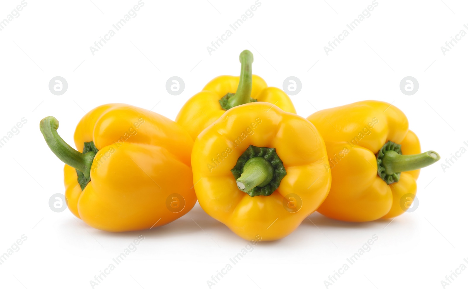 Photo of Ripe yellow bell peppers isolated on white