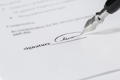 Signing notary document with fountain pen, closeup