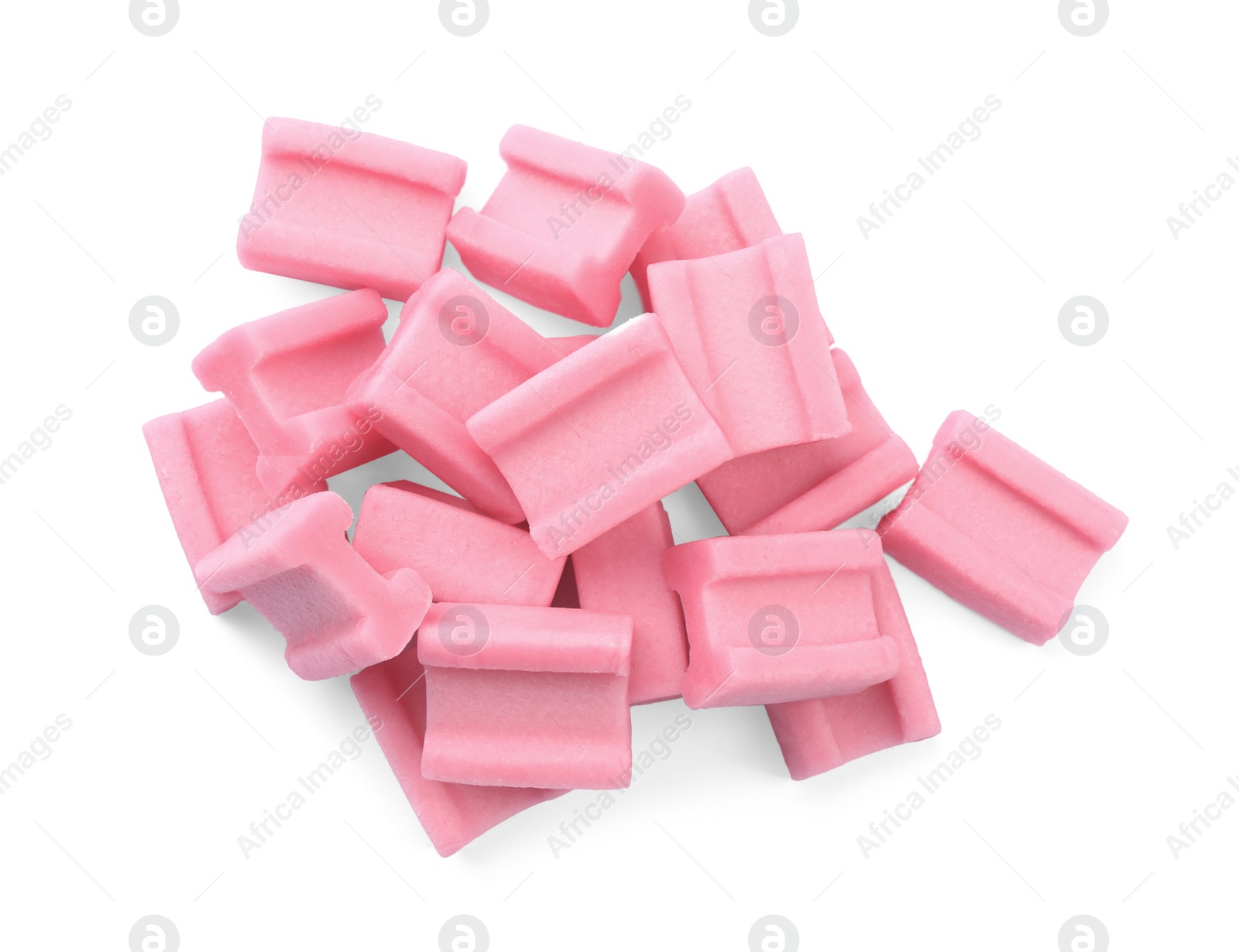 Photo of Pile of tasty pink chewing gums on white background, top view