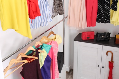 Photo of Modern dressing room with different stylish clothes and accessories