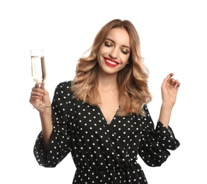 Photo of Happy young woman with glass of champagne on white background. Christmas celebration