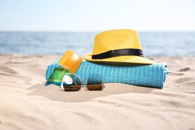 Set of beach objects on sand near sea