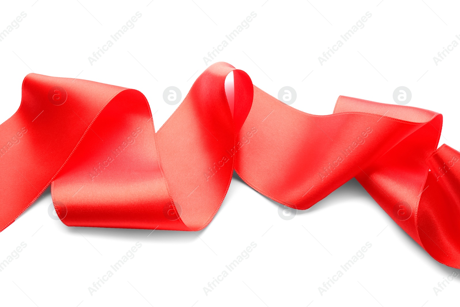 Photo of Simple red ribbon on white background. Festive decoration