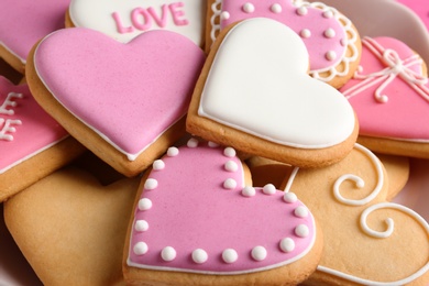 Photo of Decorated heart shaped cookies, closeup. Valentine's day treat