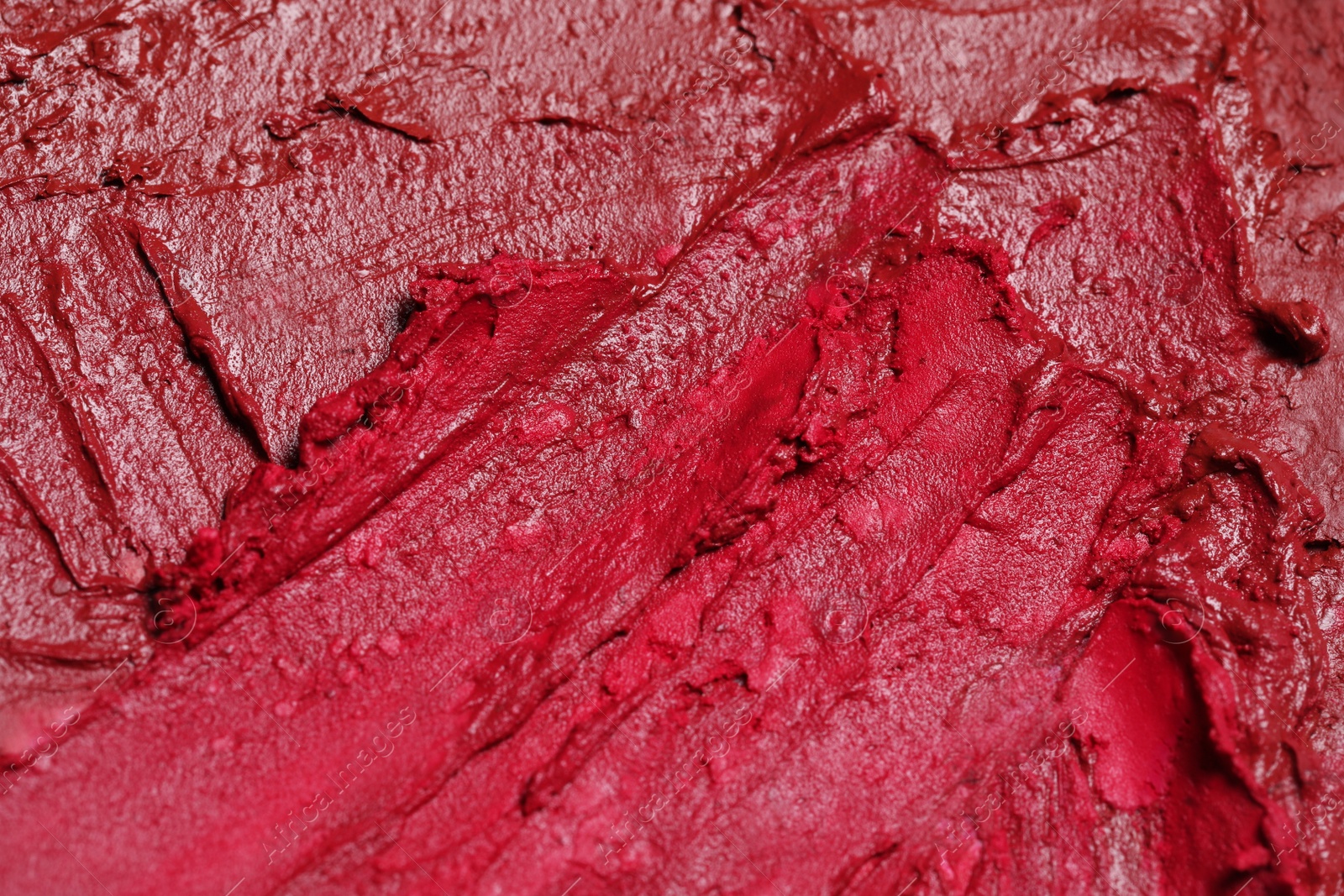 Photo of Texture of beautiful lipsticks as background, closeup