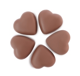 Photo of Delicious heart shaped chocolate candies on white background, top view