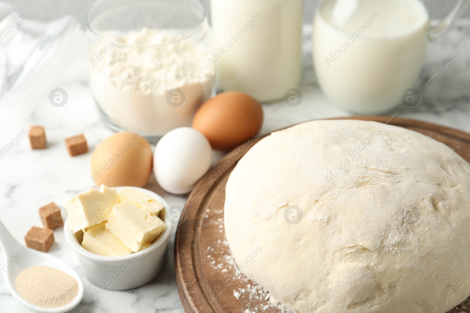 Photo of Fresh dough for pastries on white marble table