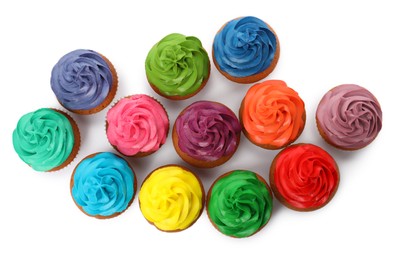 Different delicious colorful cupcakes on white background, top view