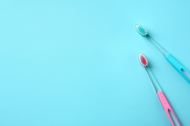 Photo of Manual toothbrushes on color background. Dental care