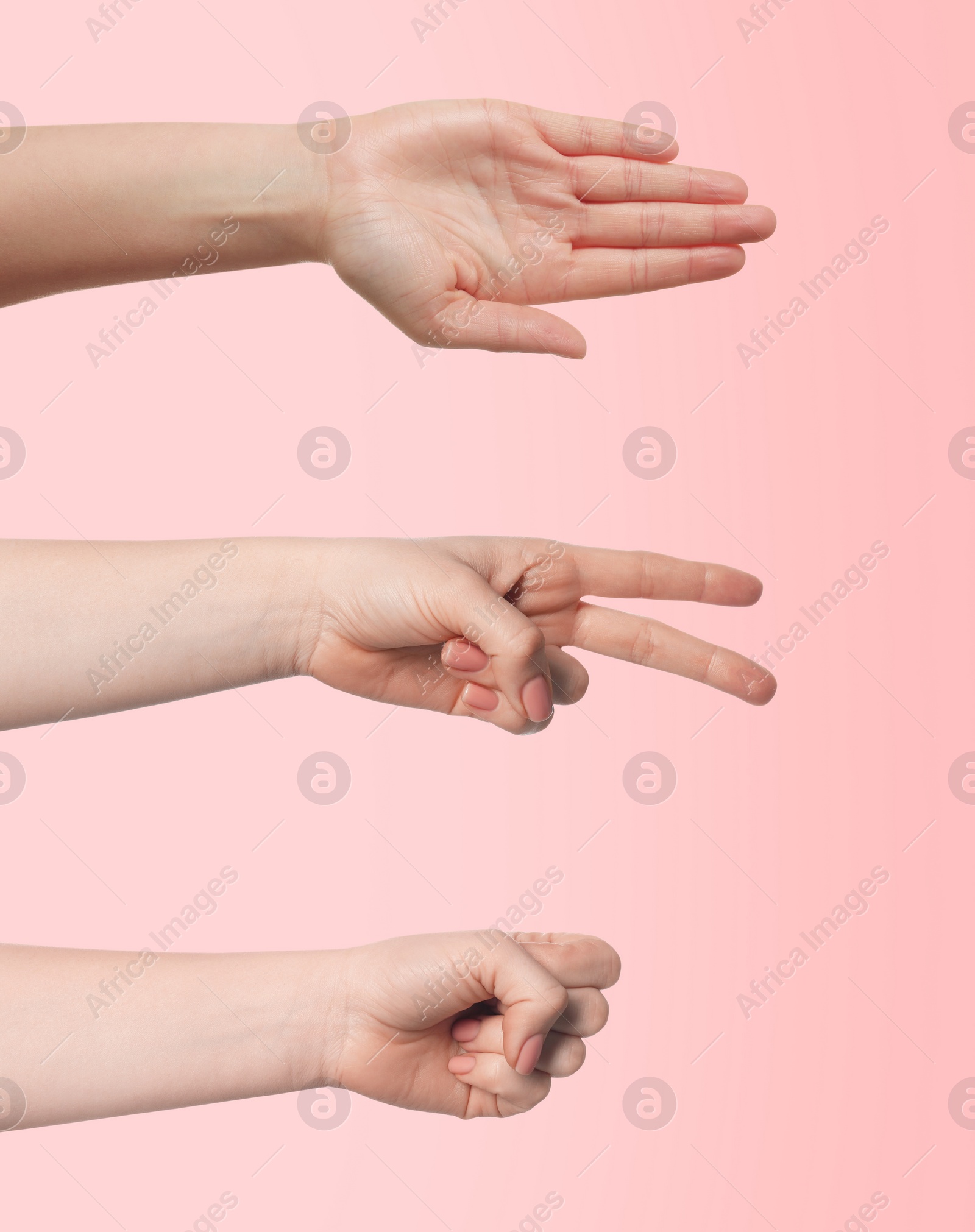 Image of People playing rock, paper and scissors on pink background, closeup