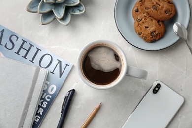 Creative flat lay composition with delicious hot coffee on table