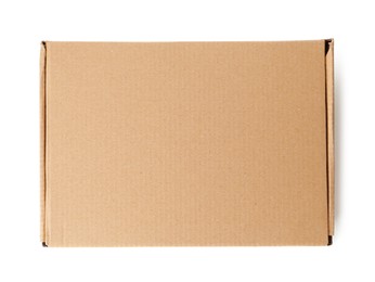 Photo of One closed cardboard box isolated on white, top view