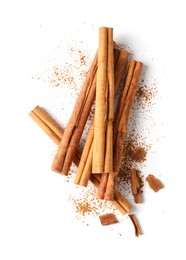 Photo of Dry aromatic cinnamon sticks and powder isolated on white, top view