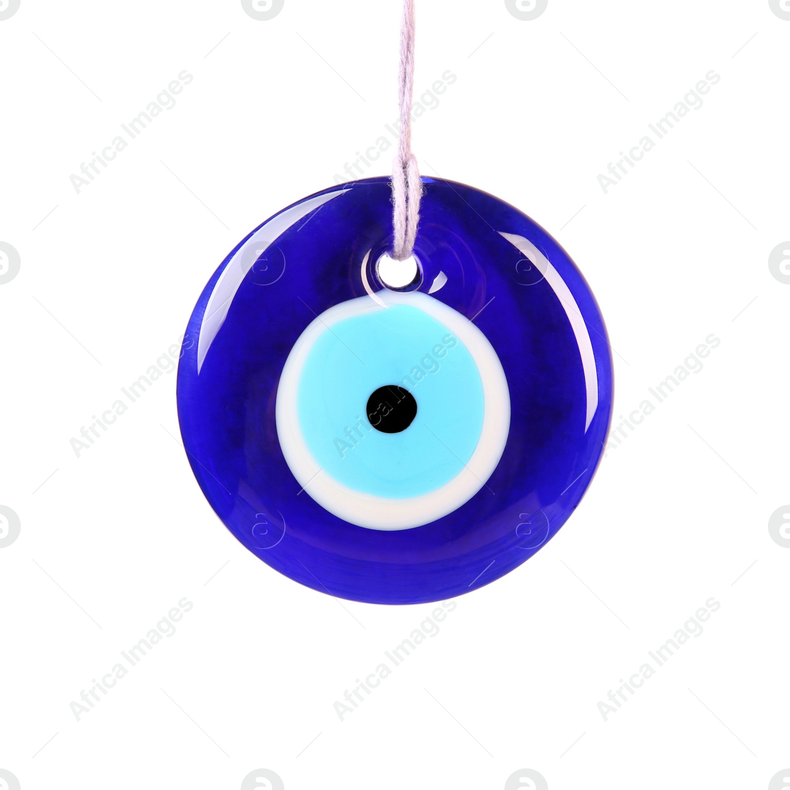 Photo of Evil eye amulet hanging on white background