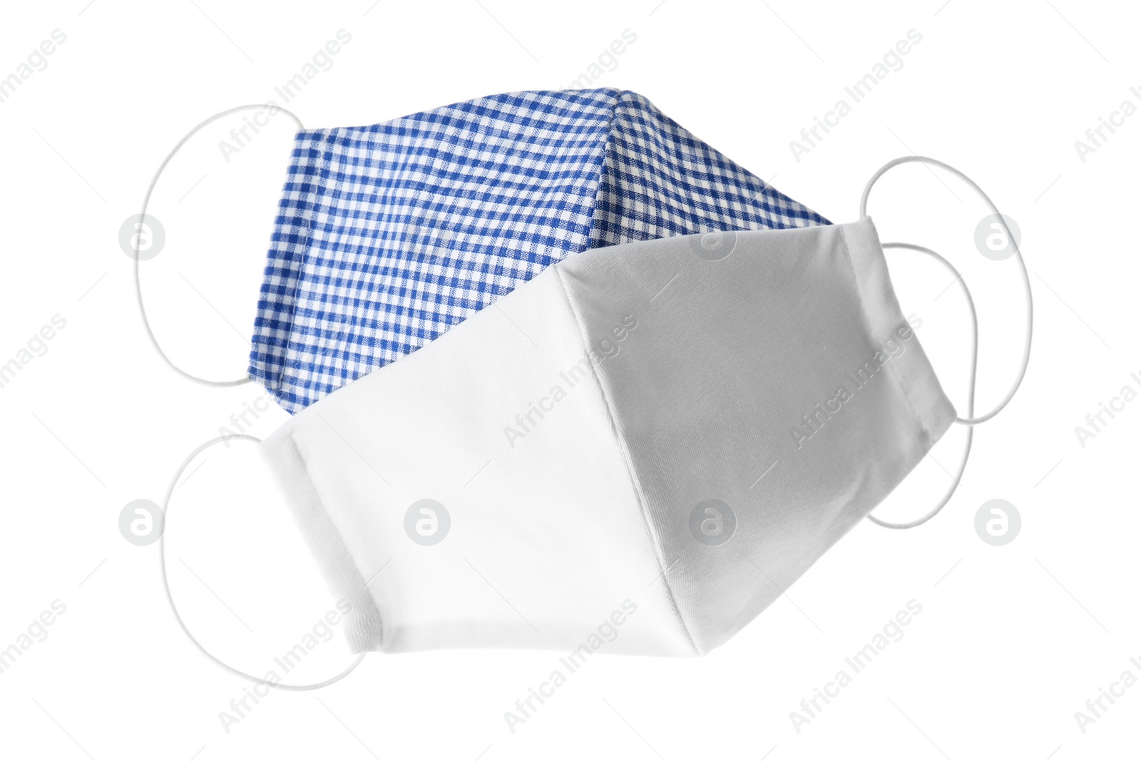 Photo of Homemade protective face masks isolated on white, top view