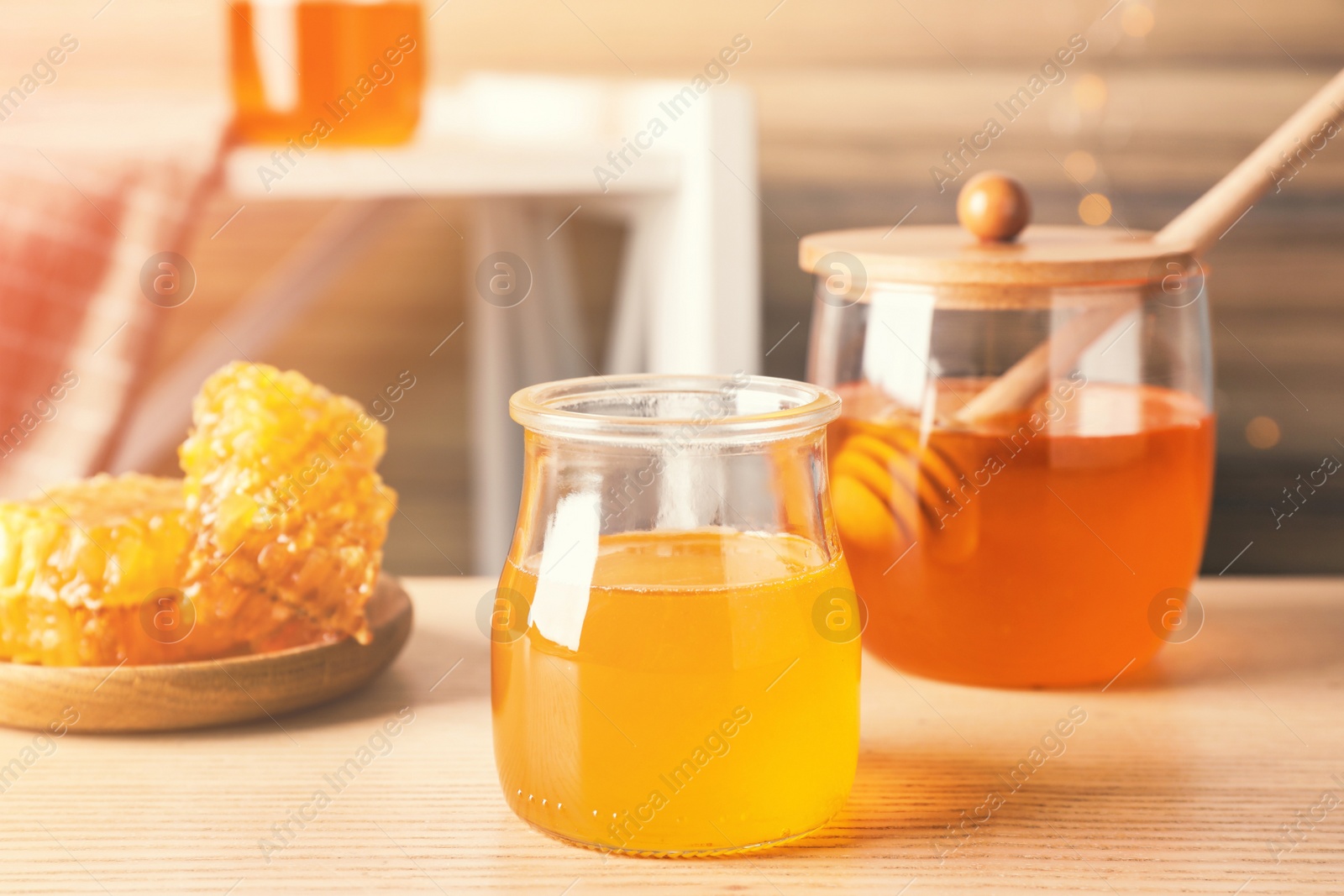 Image of Tasty fresh organic honey on wooden table