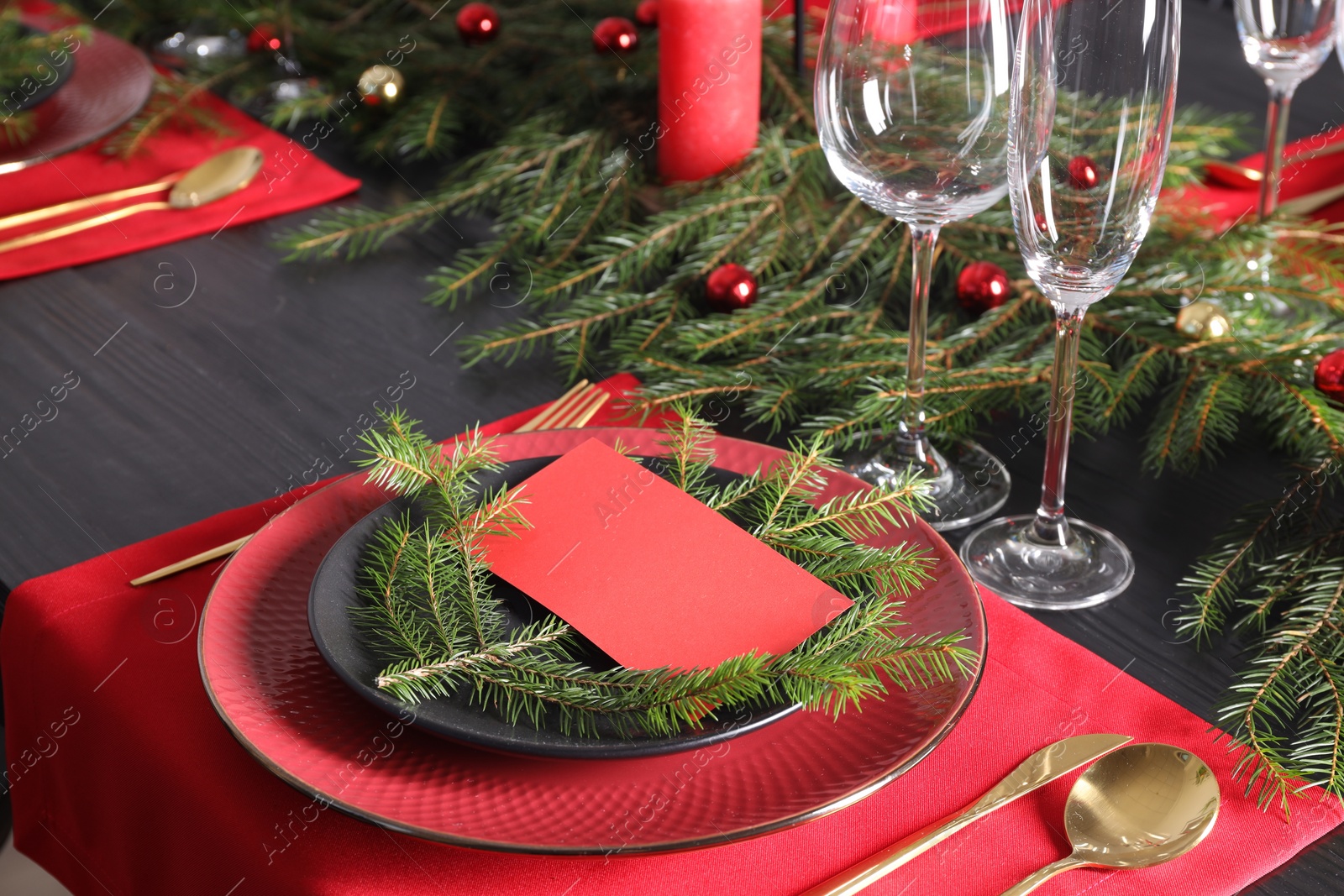 Photo of Elegant Christmas table setting with blank place card and festive decor