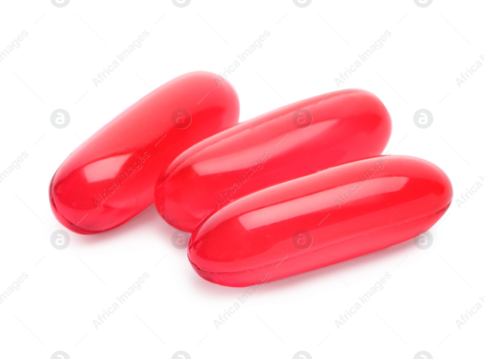 Photo of Pile of color pills on white background