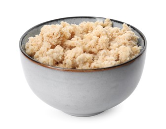 Bowl of tasty prepared horseradish isolated on white