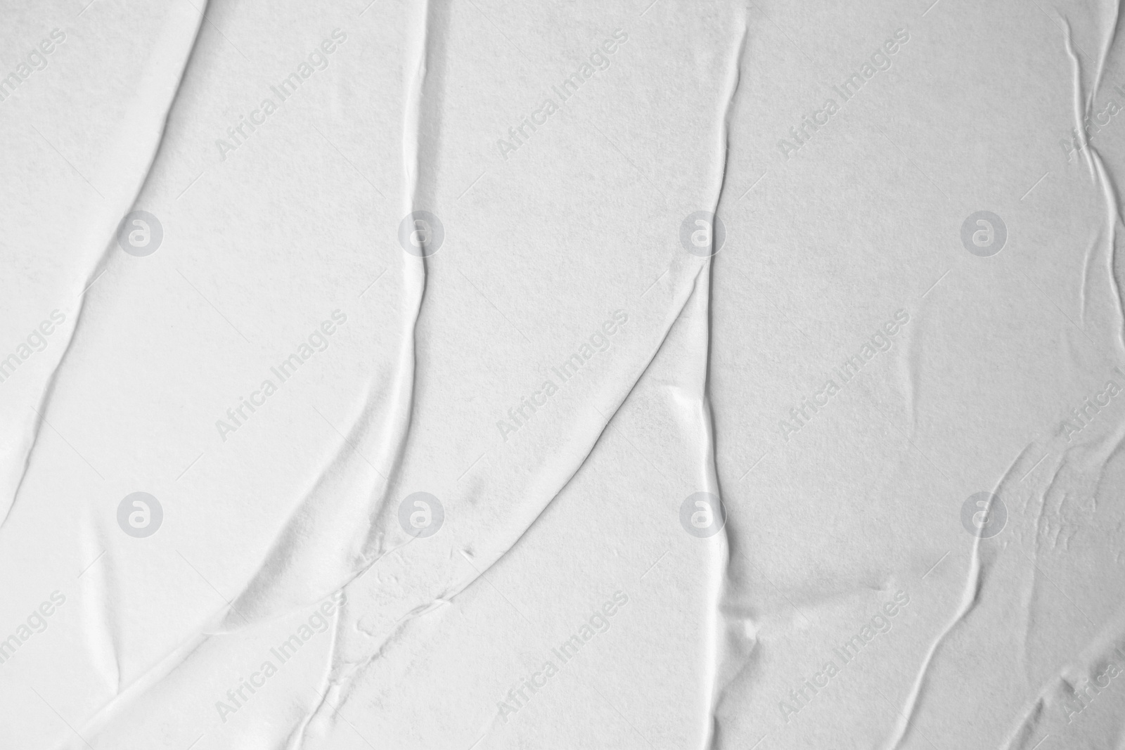 Photo of Texture of white creased paper, closeup view