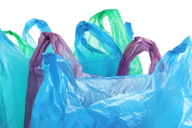 Photo of Many different plastic bags on white background