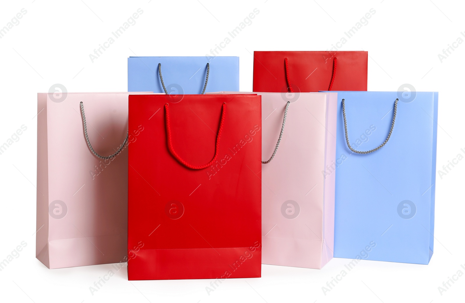 Photo of Colorful paper shopping bags on white background