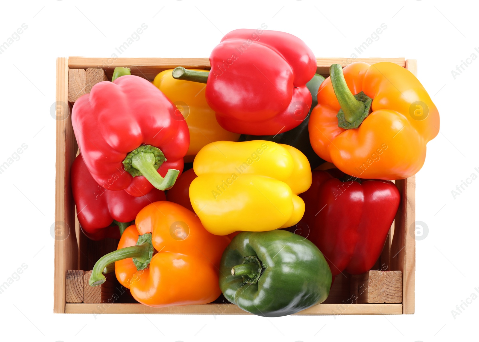 Photo of Wooden crate full of fresh ripe colorful bell peppers isolated on white, top view