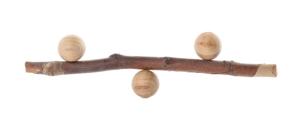 Photo of Tree branch with wooden balls on white background. Harmony and balance concept