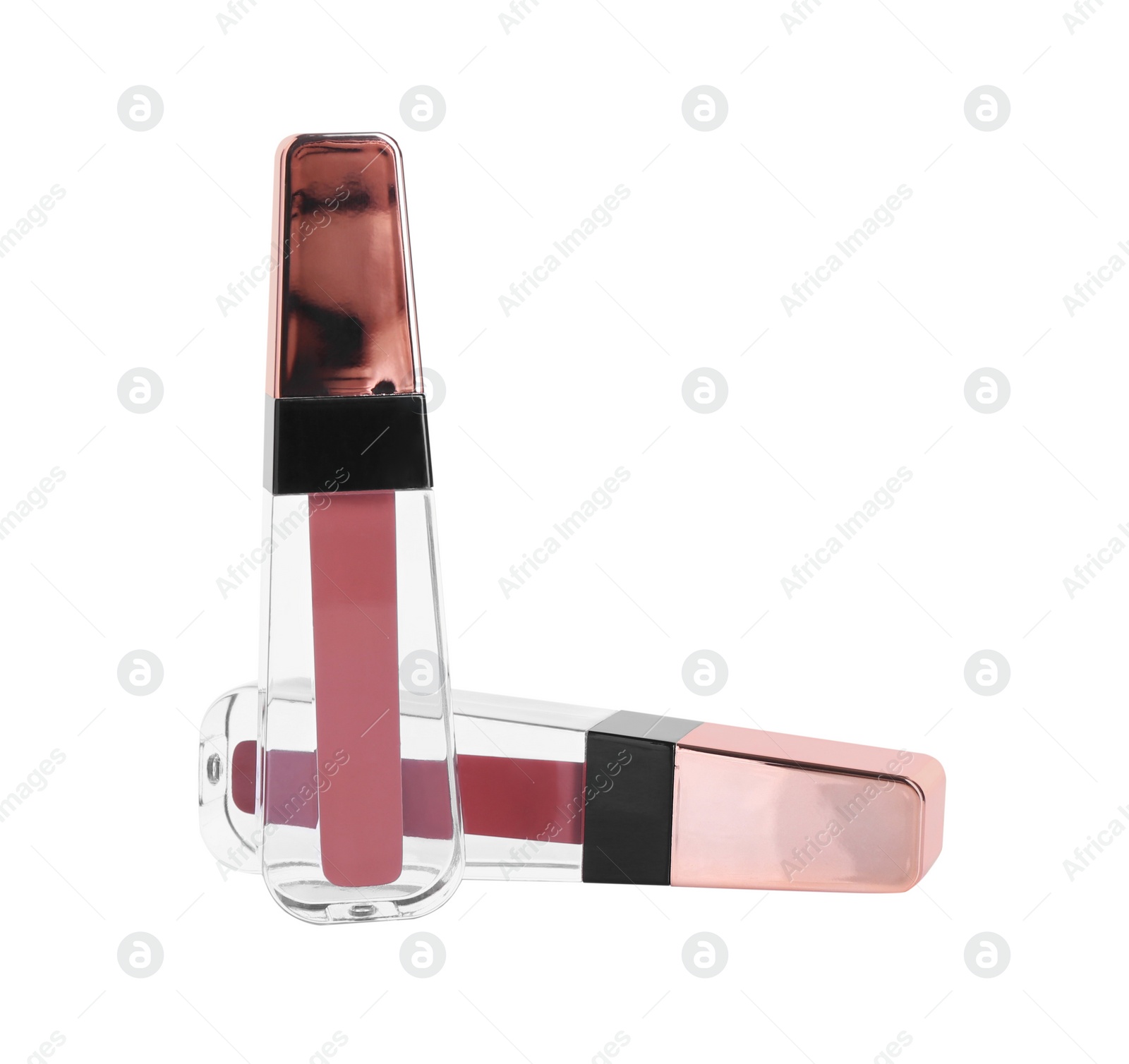 Photo of Two lip glosses isolated on white. Cosmetic products