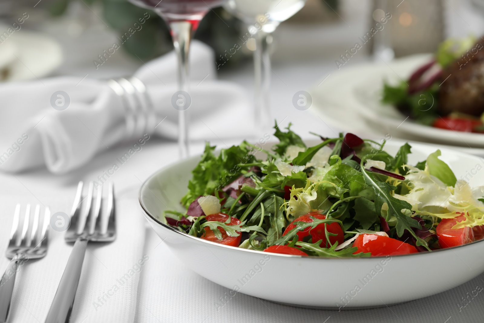 Photo of Delicious salad served on table in restaurant