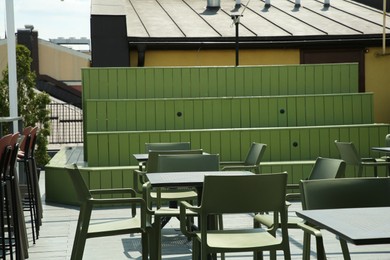 Photo of Many chairs and tables at beautiful outdoor cafe